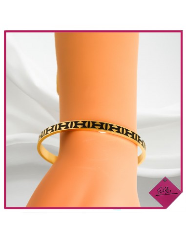 Bracelet demi jonc en acier doré, motif ronds noirs